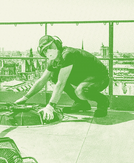 Multi-technical technician holding an air vent on the roof of a parisian building 